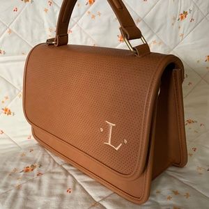 Genuine, monogrammed “Thirty-one” purse.